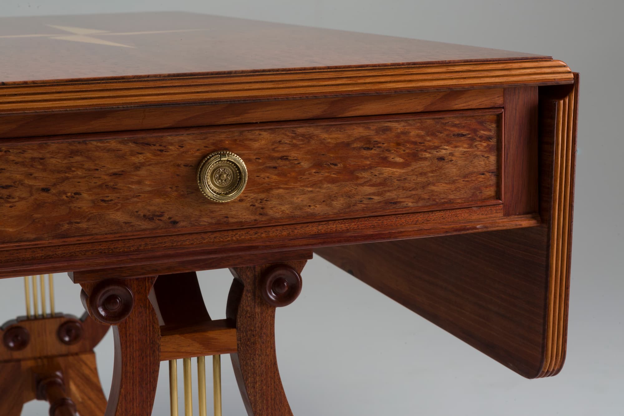 Close up blackwood huon pine desk drawer handle
