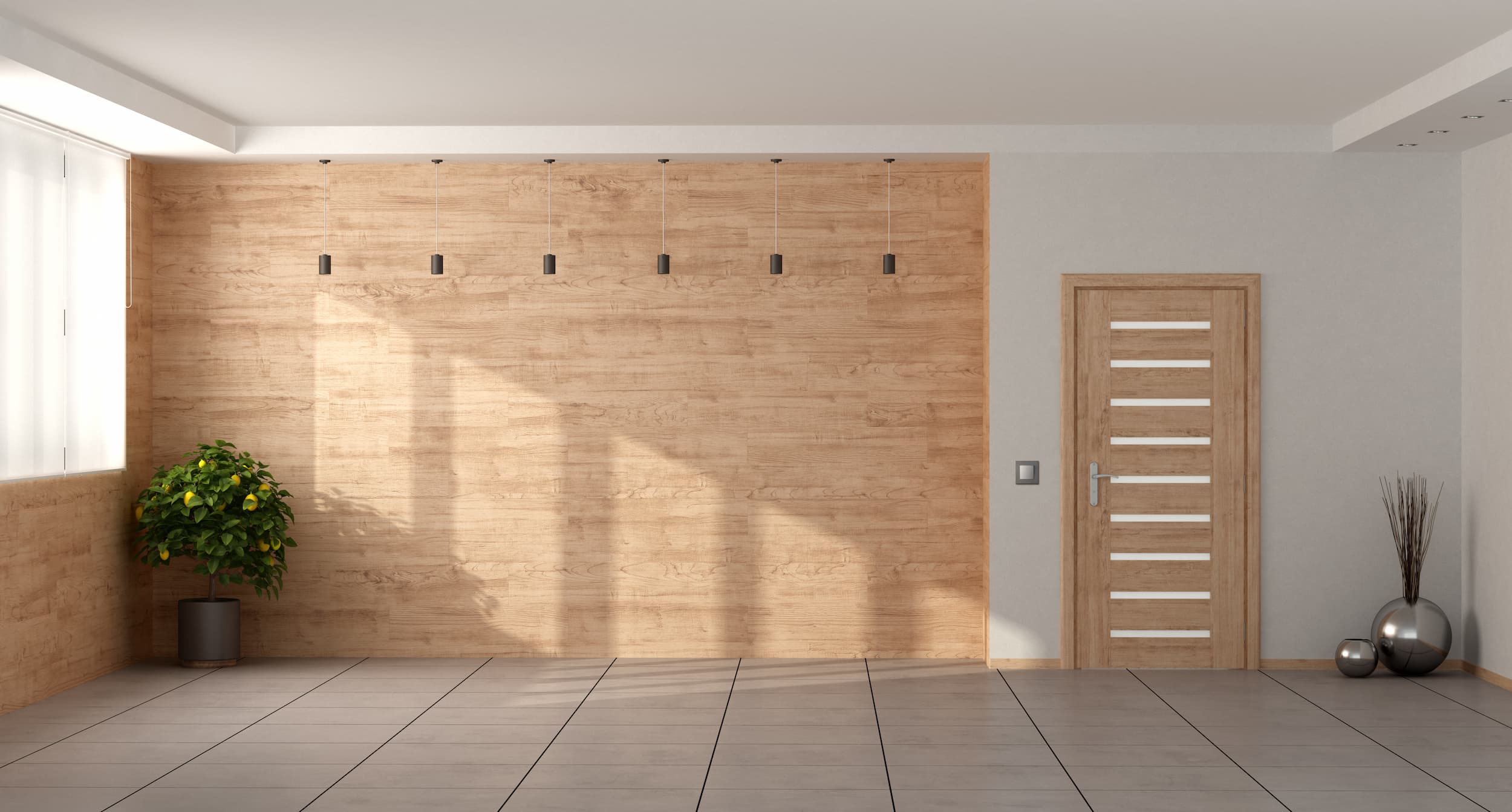 A modern minimalist living room with a wooden accent wall, a stylish wooden door, hanging lights, and decorative plants.