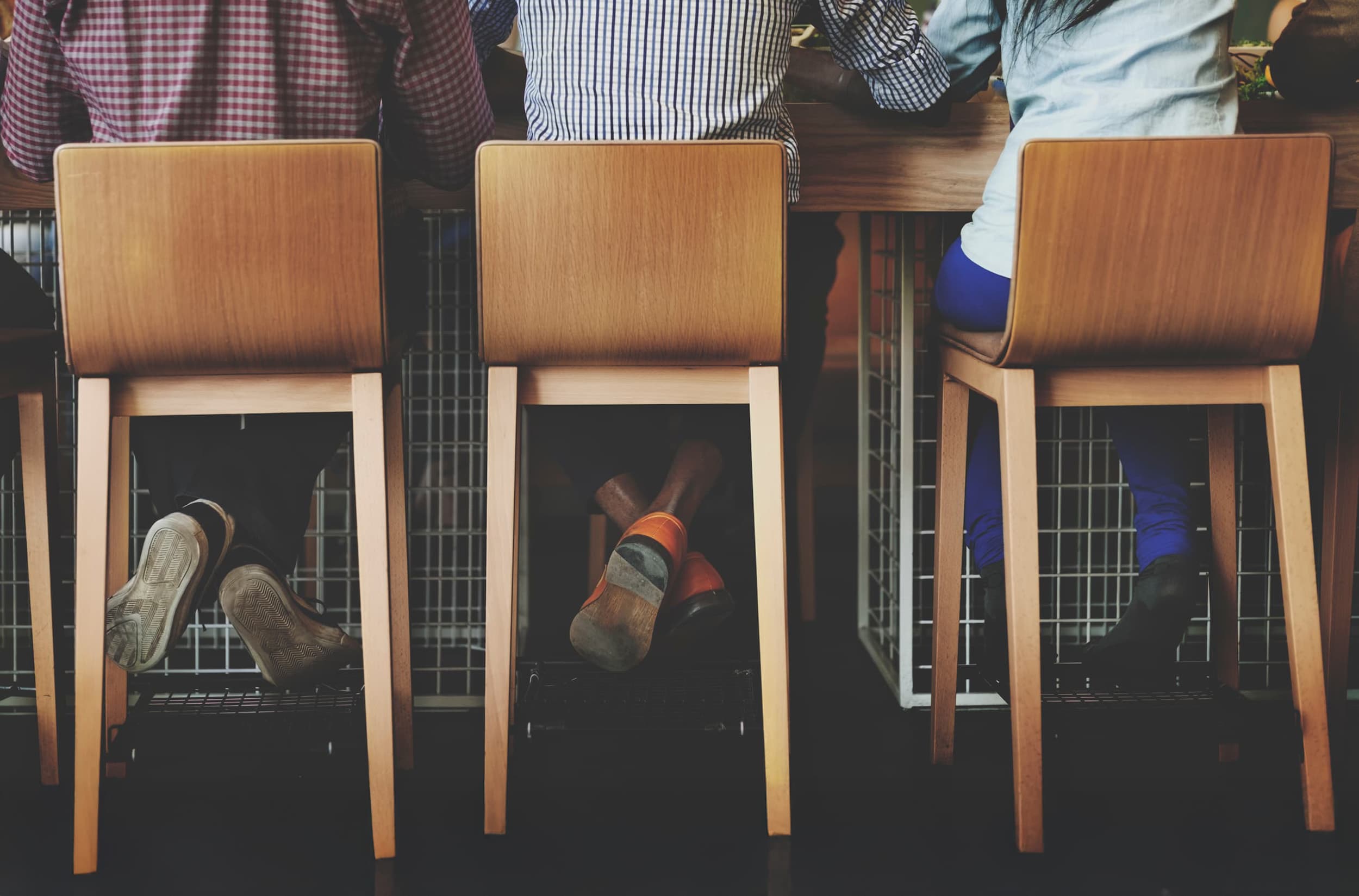 Custom timber dining stools in hospitality setting