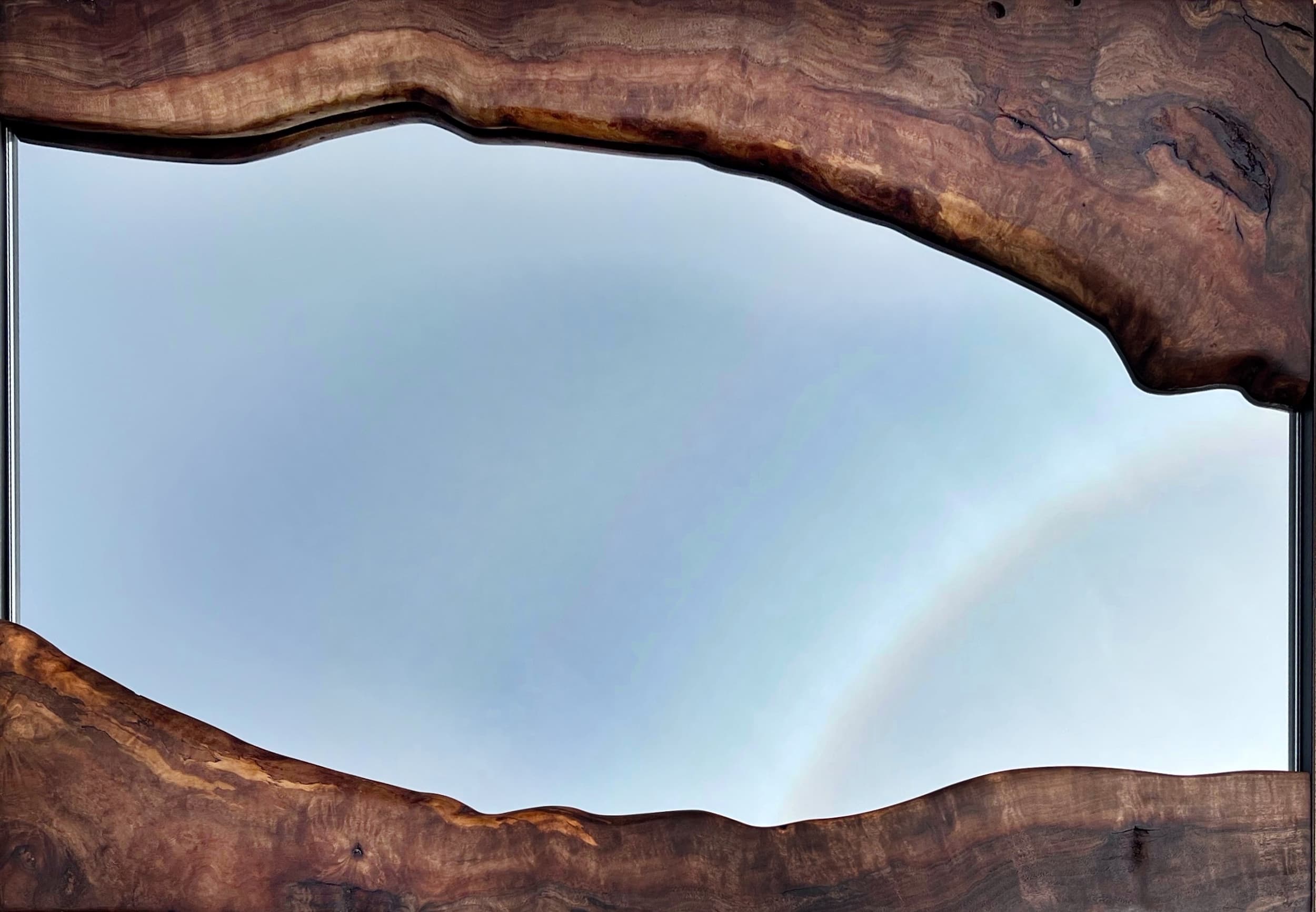 Live edge walnut timber mirror frame with natural wood grain detail