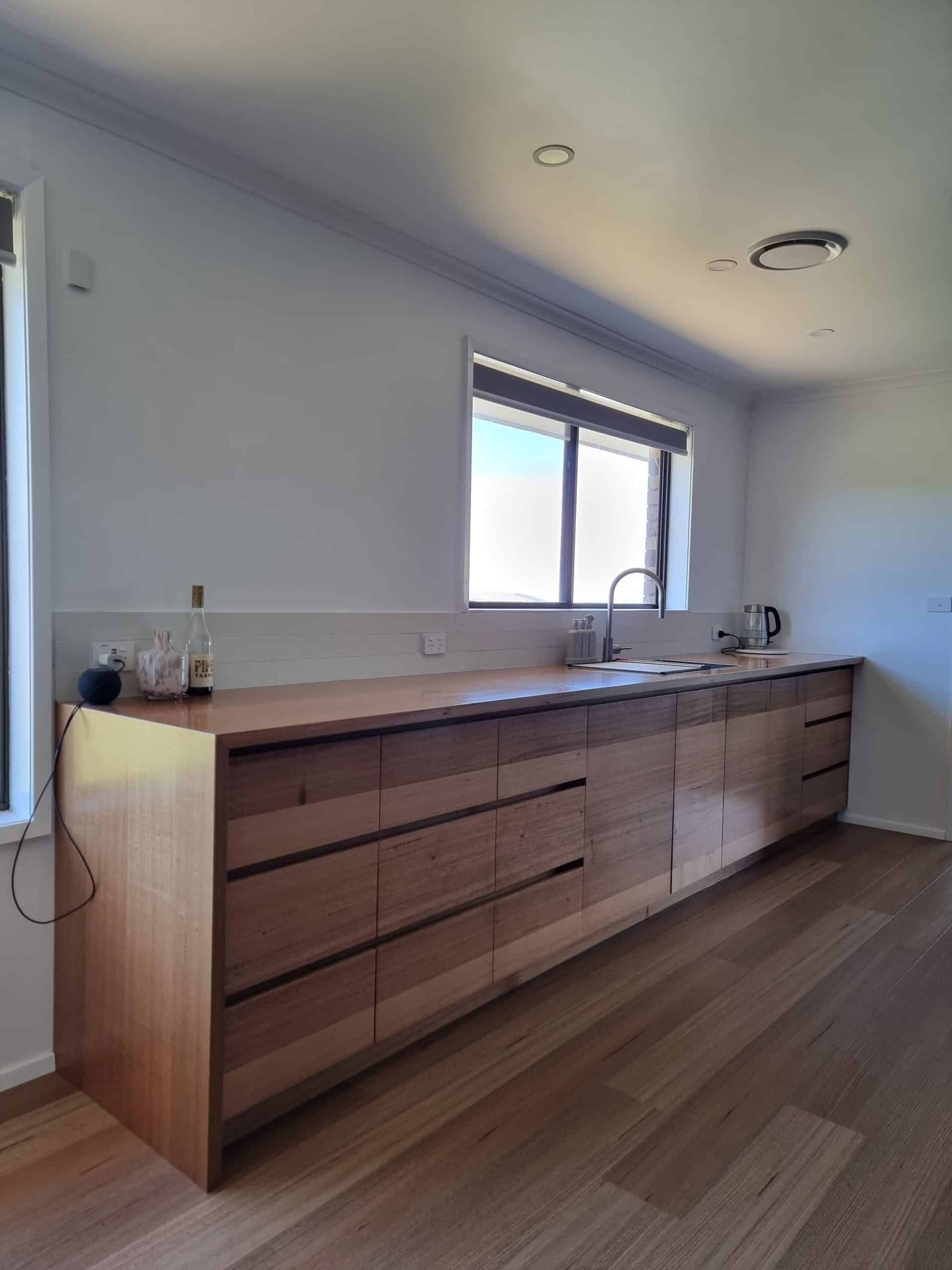 Solid Tasmanian Oak kitchen cabinetry with timber benchtop