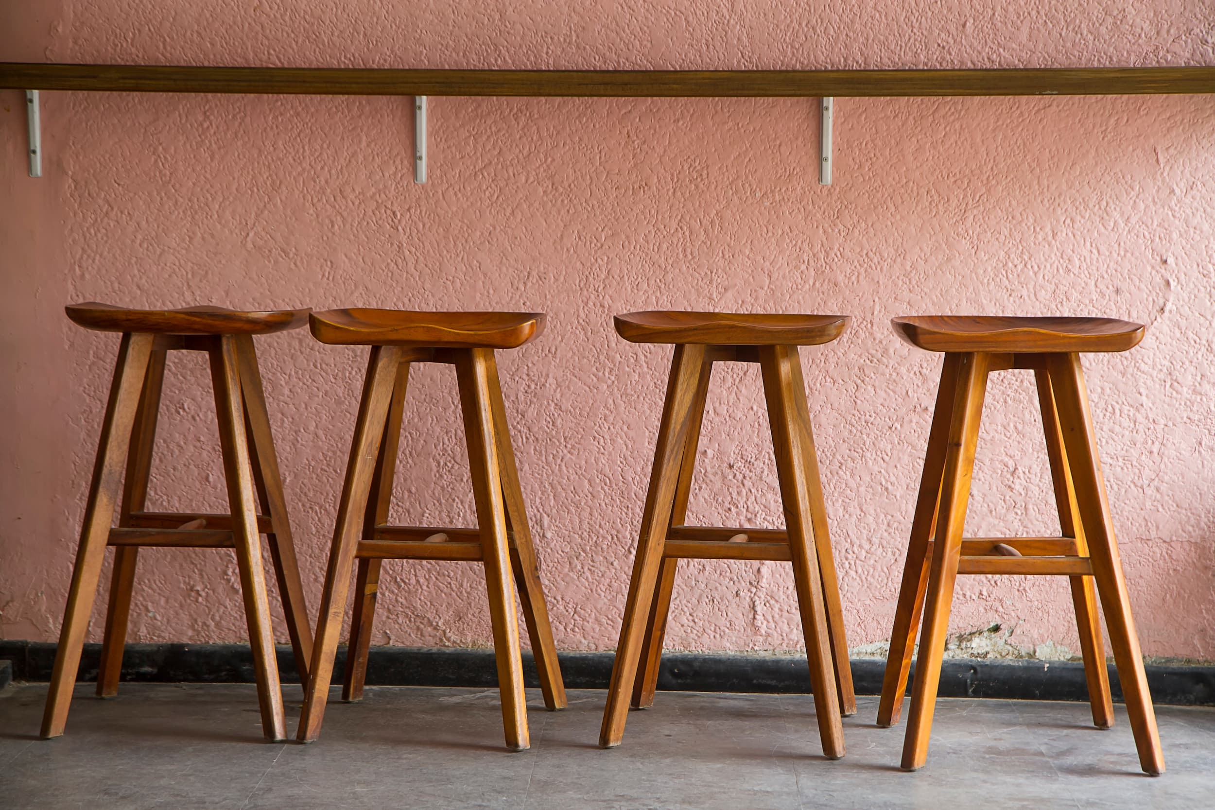 Solid timber bar stools with sculpted seats