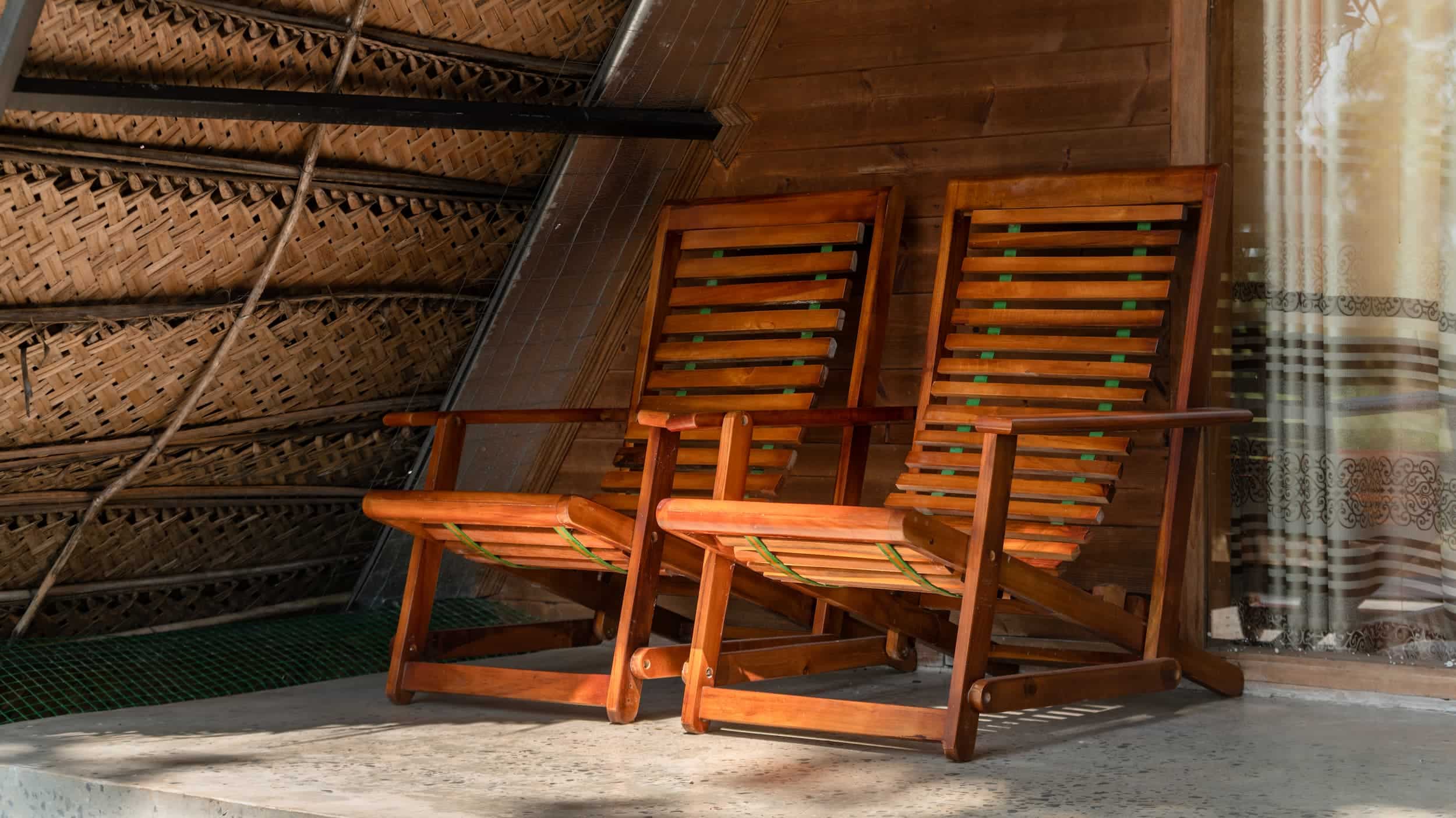 Solid timber rocking chairs on covered veranda
